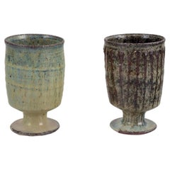 Gutte Eriksen, Denmark. Two cups in ceramic, raku technique, flowing lava glaze
