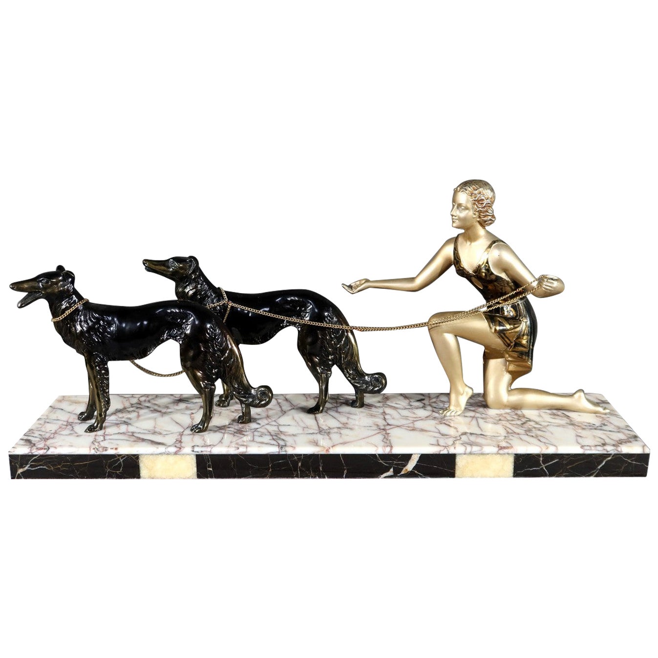 Mujer con galgos en metal patinado, escultura Art Decó - 1930