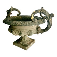Large 19th Century French Iron Garden Urn with an embellished, scrolled handles