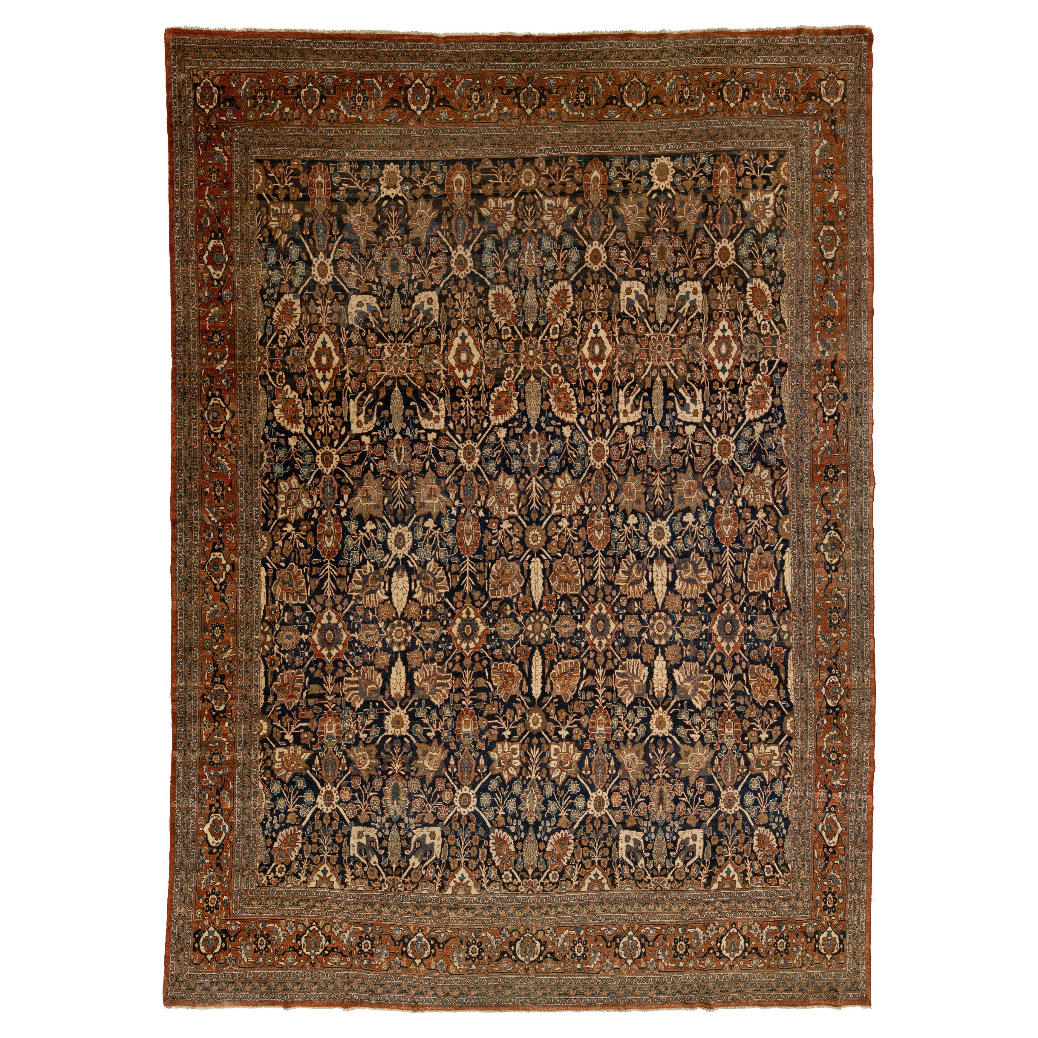 Antico tappeto persiano in lana Tabriz con classico disegno floreale in blu e ruggine
