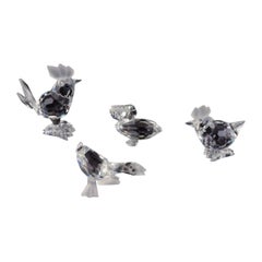 Swarovski, Austria. Four miniature figures in faceted cut crystal glass.