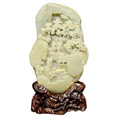 Chinese Large Boulder Carved Light Celadon/ White Jade with A Mountainside Scene