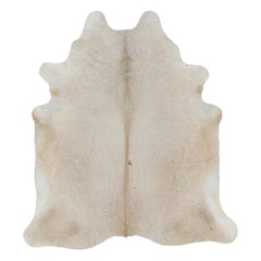 Rug & Kilim’s Extra Large Cowhide Rug in Beige and Cream Tones