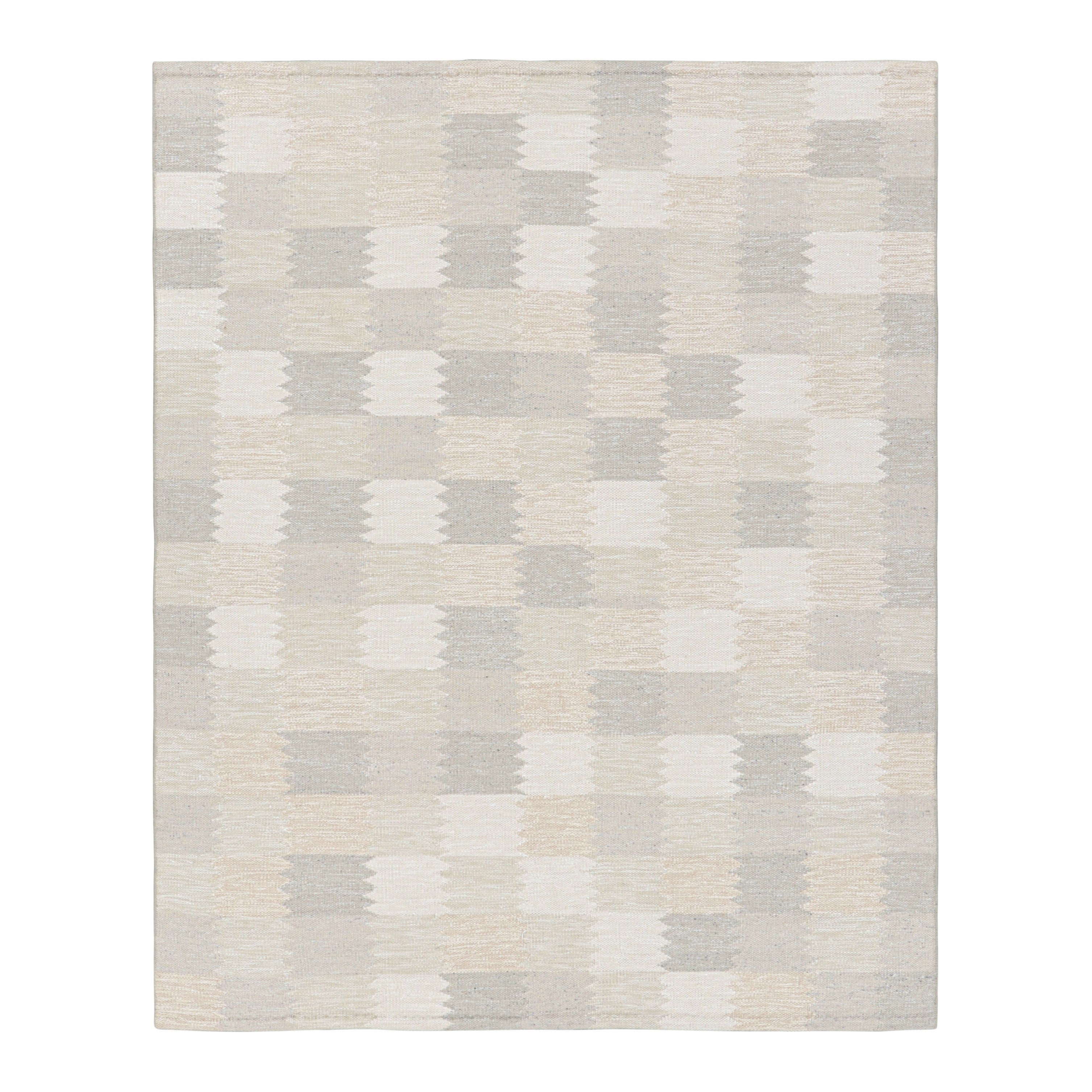 Rug & Kilim è un tappeto in stile scandinavo di colore grigio e bianco con motivi geometrici.