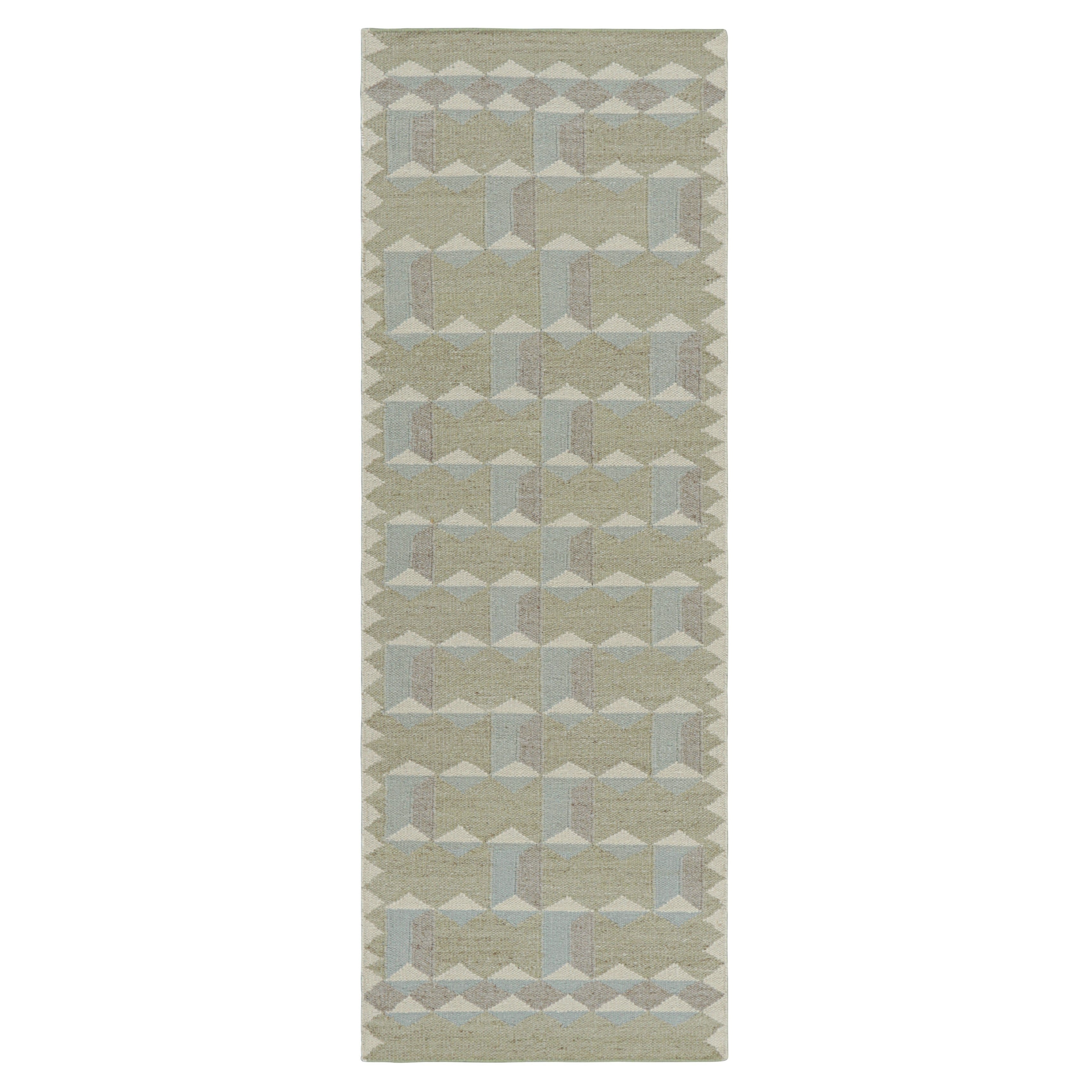 Tapis de style scandinave à motifs géométriques beige, blanc et bleu de Rug & Kilim