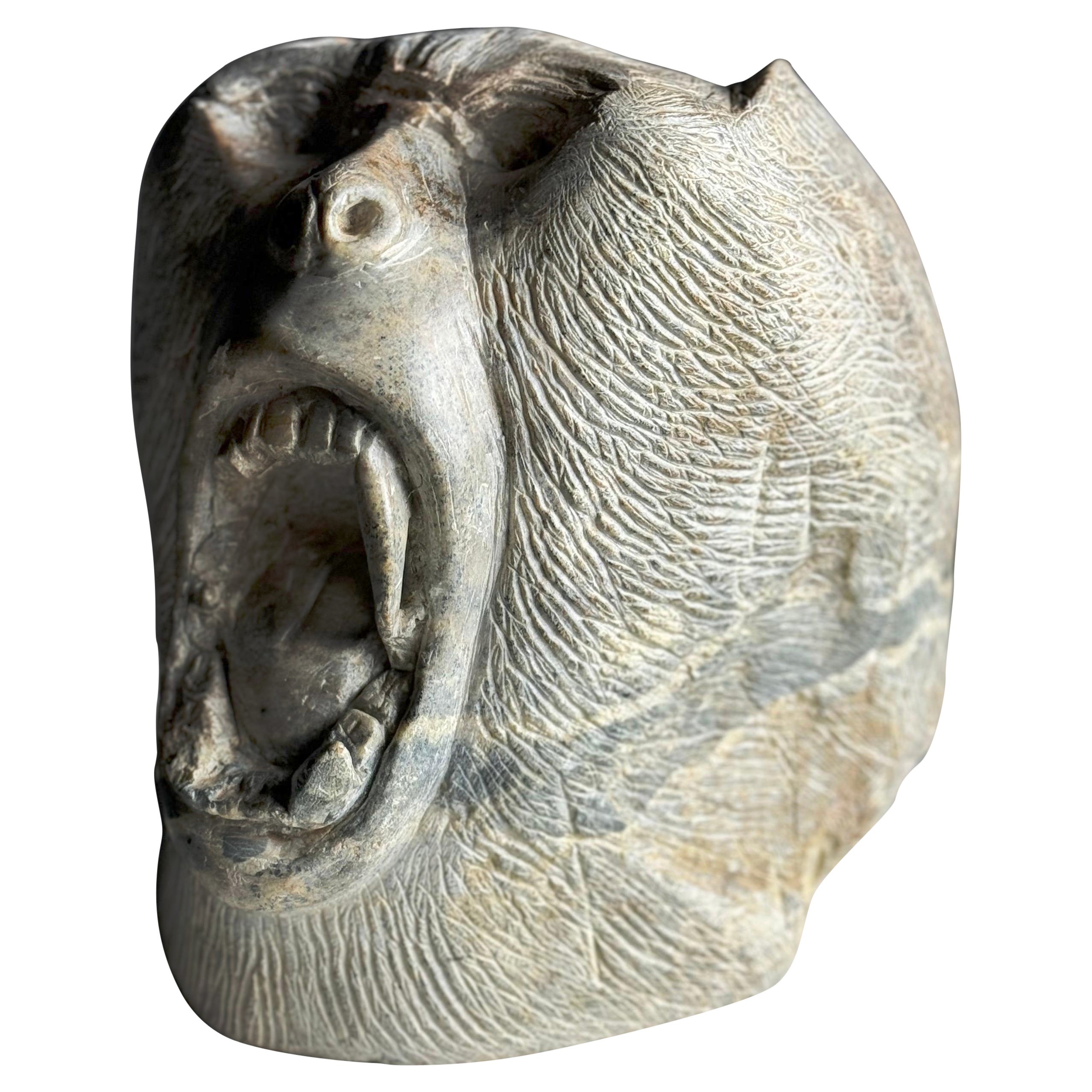 Tête de pierre sculptée d'Ape 20ème siècle