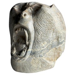 Carved stone head of Ape 20th century