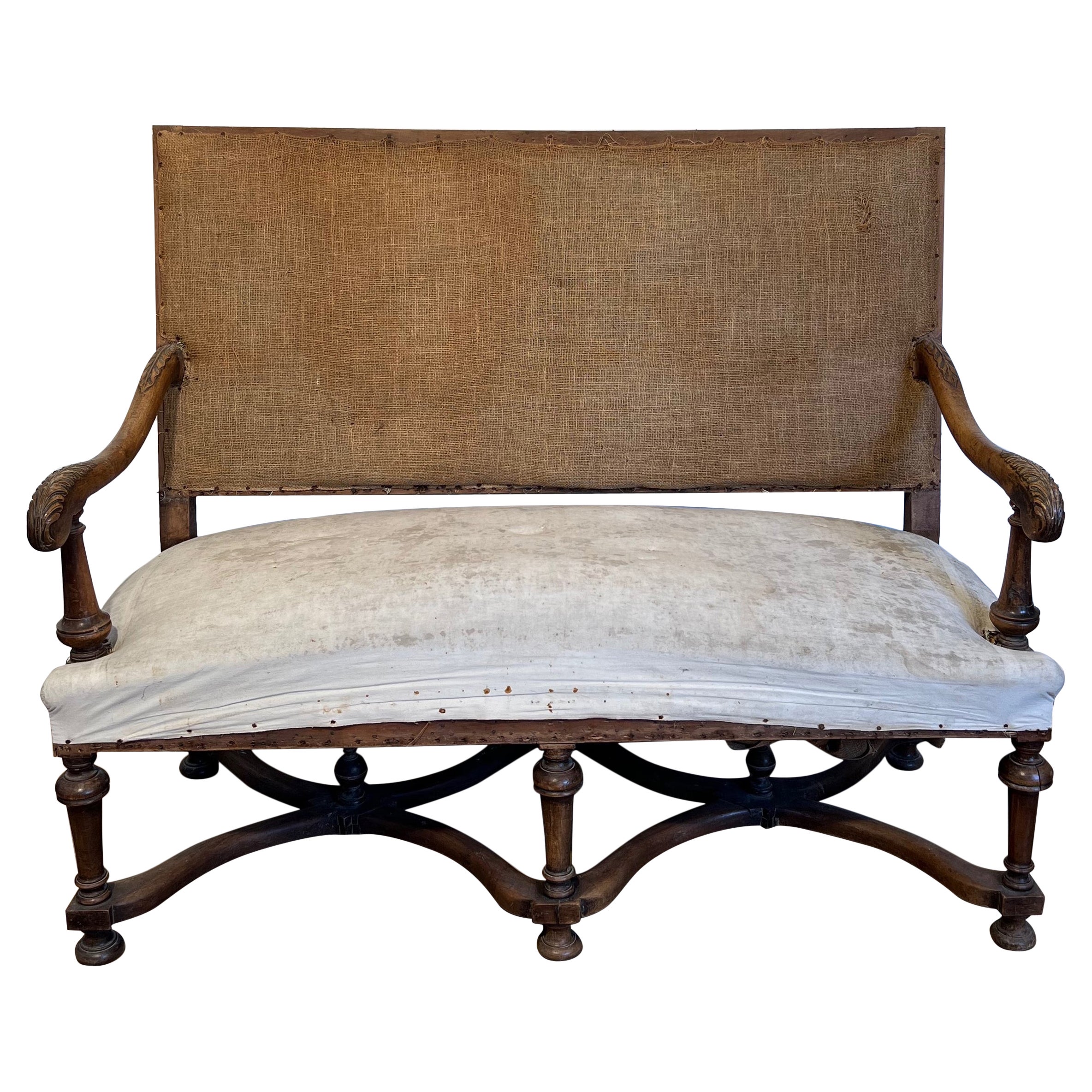 High-backed walnut sofa. French work in the style of Louis XIII. Circa  1880