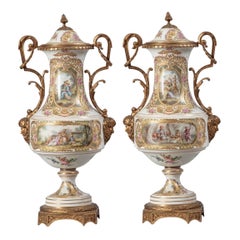 A Pair of 1800s Ormolu-Mounted French Sevres Style Drum-Shaped Vases and Covers