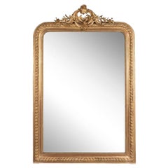 Very large French carved Regency style mirror with small pediment