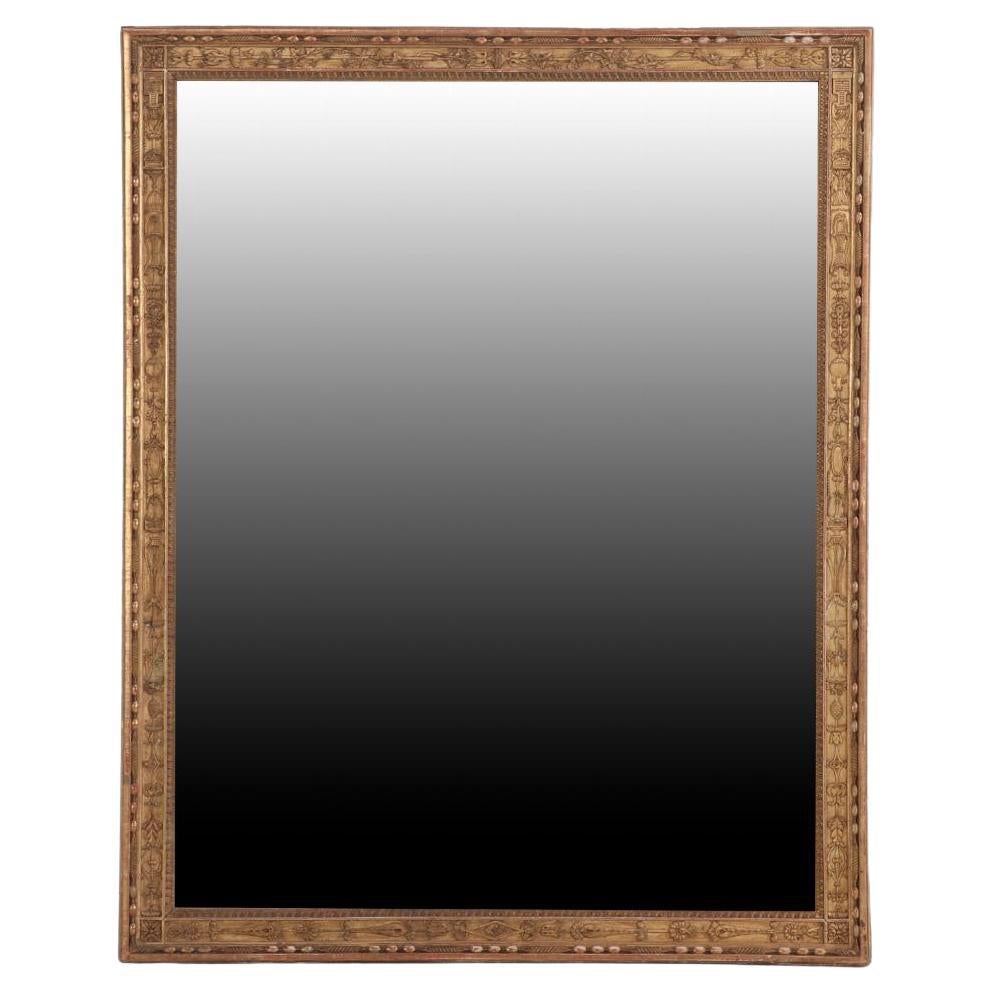 A French Empire gold mirror, 19th C.