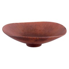 Carl Harry Stålhane for Rörstrand. Large ceramic bowl with glaze in brown tones.
