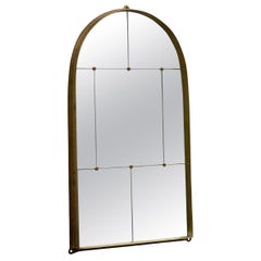 Segmented Mirror by Jordan Hufnagel with arched brass frame