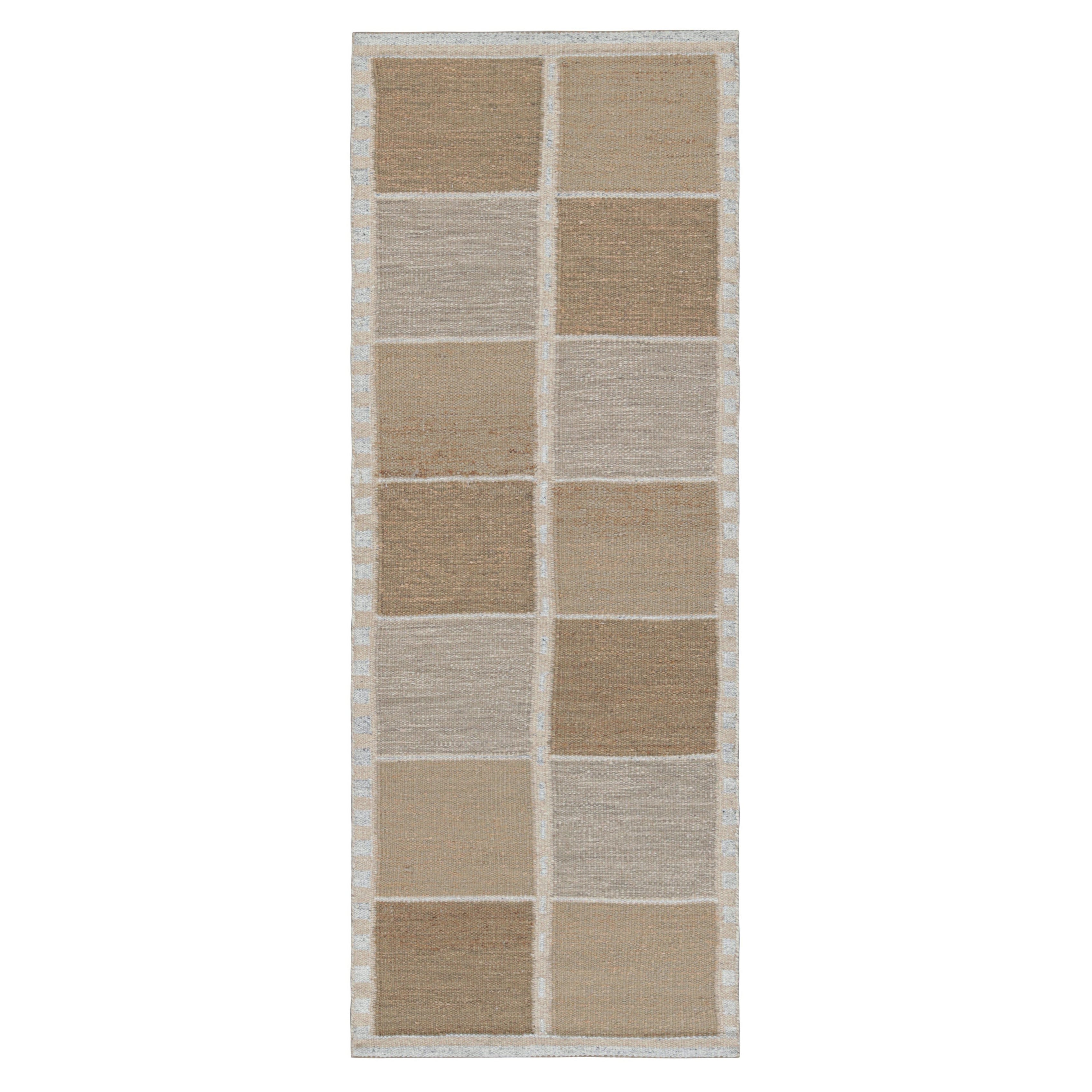 Rug & Kilim è un tappeto runner in stile scandinavo di colore marrone con motivi geometrici