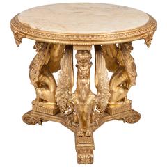 A Victorian giltwood carved centre table, with inset onyx top, circa 1895.