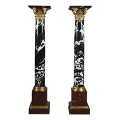 Pair of Large Antique Marble Columns with gilded bronze capitals