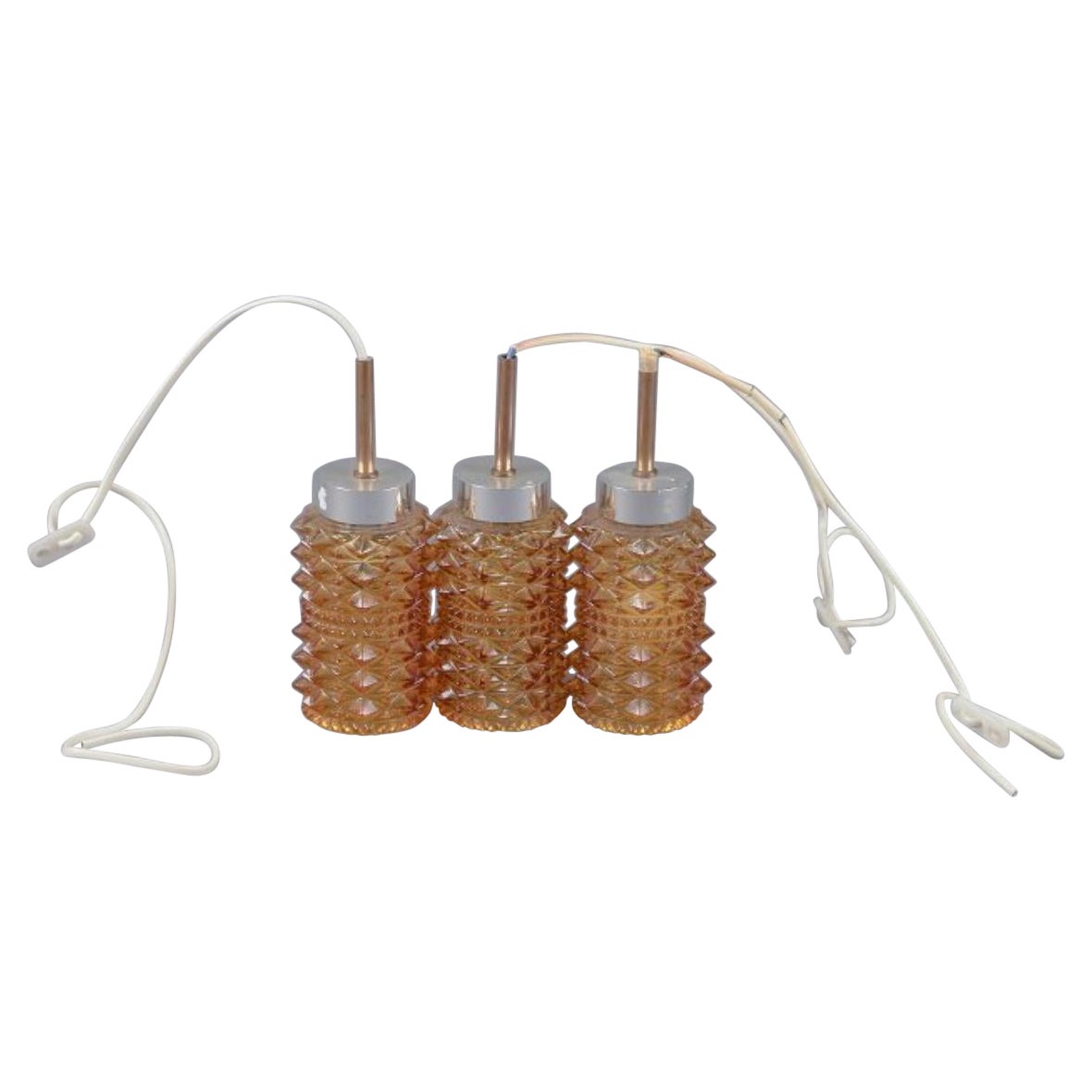 Helena Tynell. Three ceiling lamps. Stainless steel and smoke-colored glass For Sale