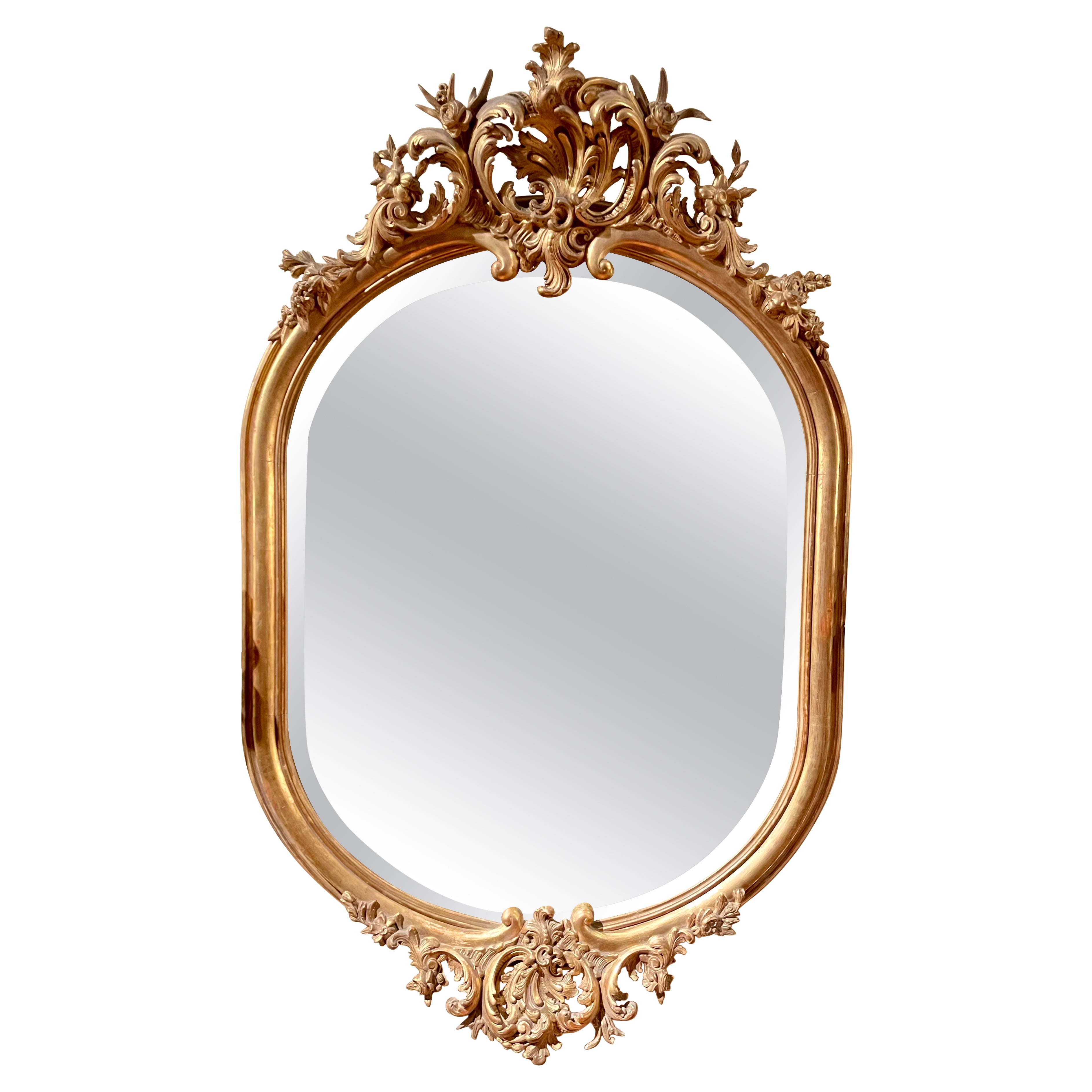 Antique French Carved Gold Leaf Wood and Beveled Oval Mirror, Circa 1890.