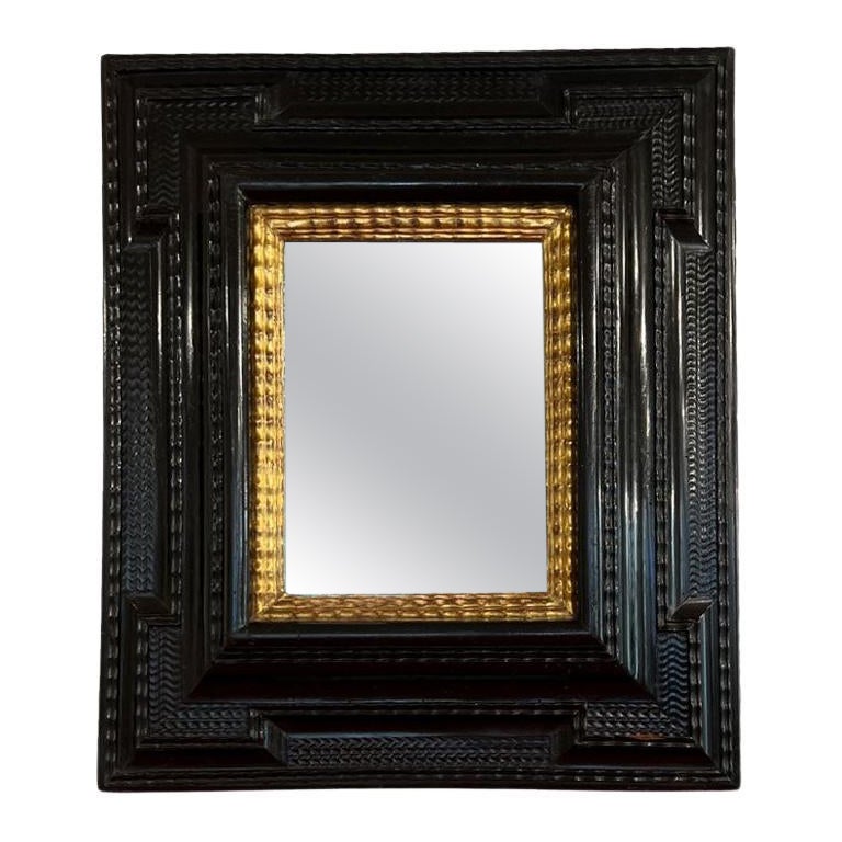 Italienischer Spiegel aus Ebenholz und Giltwood aus dem 17.