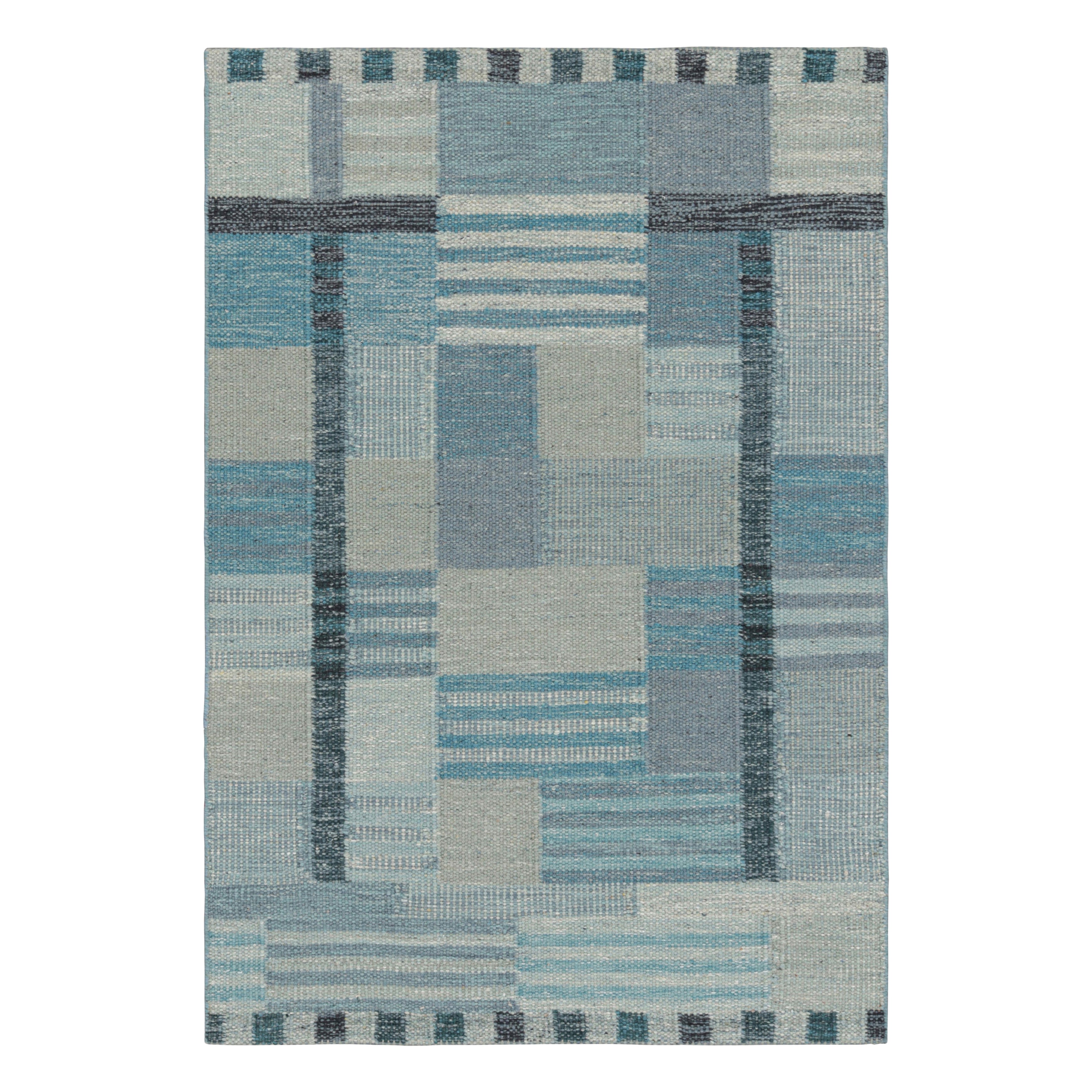 Tapis de style scandinave bleu et gris à motifs géométriques de Rug & Kilim
