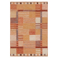 Rug & Kilim’s Scandinavian Style Rug in Orange and Pink with Geometric Patterns
