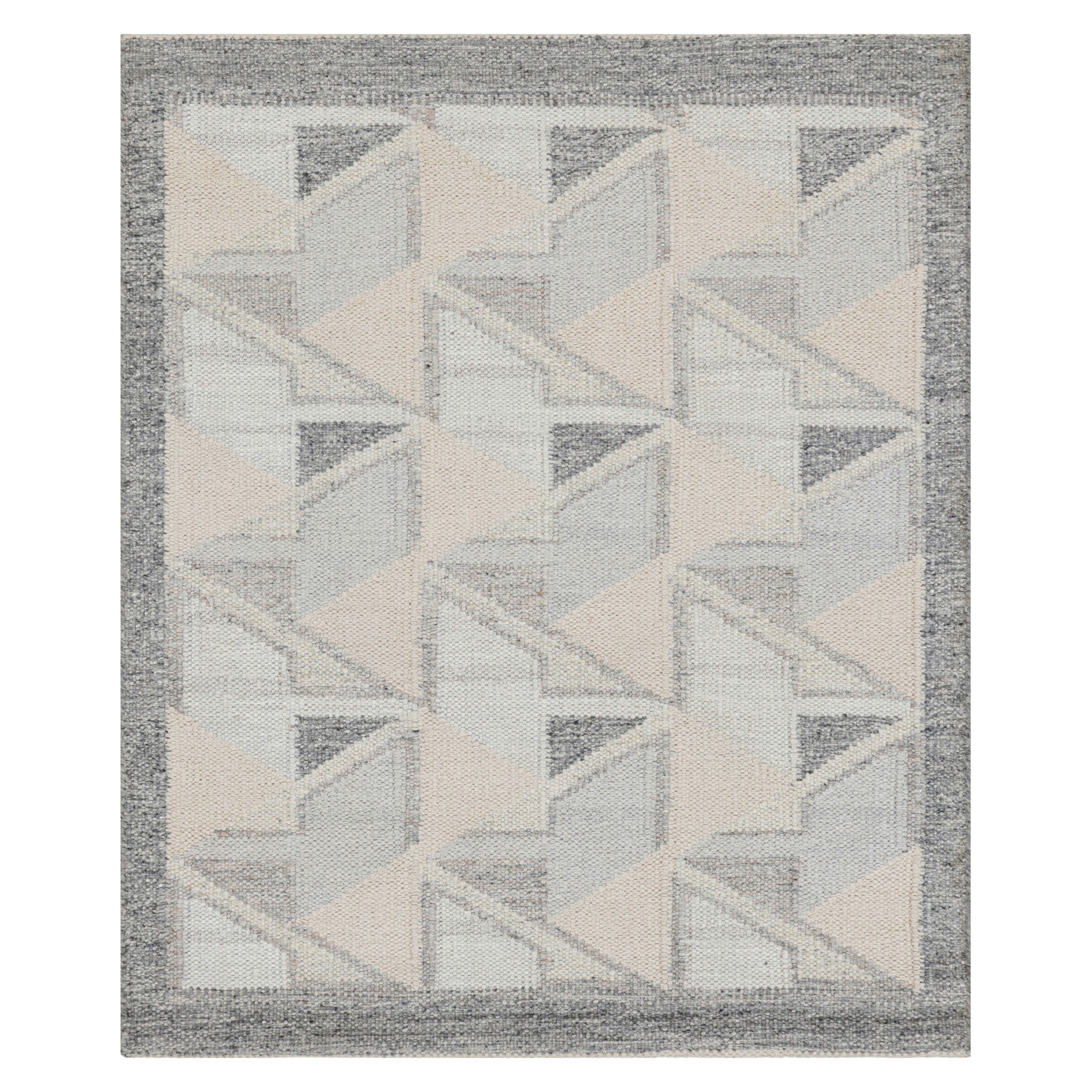 Alfombra de estilo escandinavo con dibujo geométrico azul y crema de Rug & Kilim