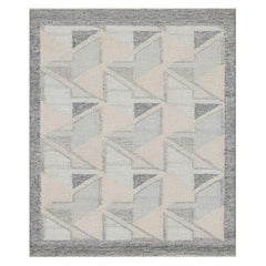 Alfombra de estilo escandinavo con dibujo geométrico azul y crema de Rug & Kilim