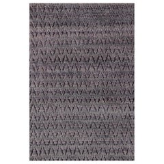 Rug & Kilim's Strukturteppich in Lila mit geometrischen Mustern