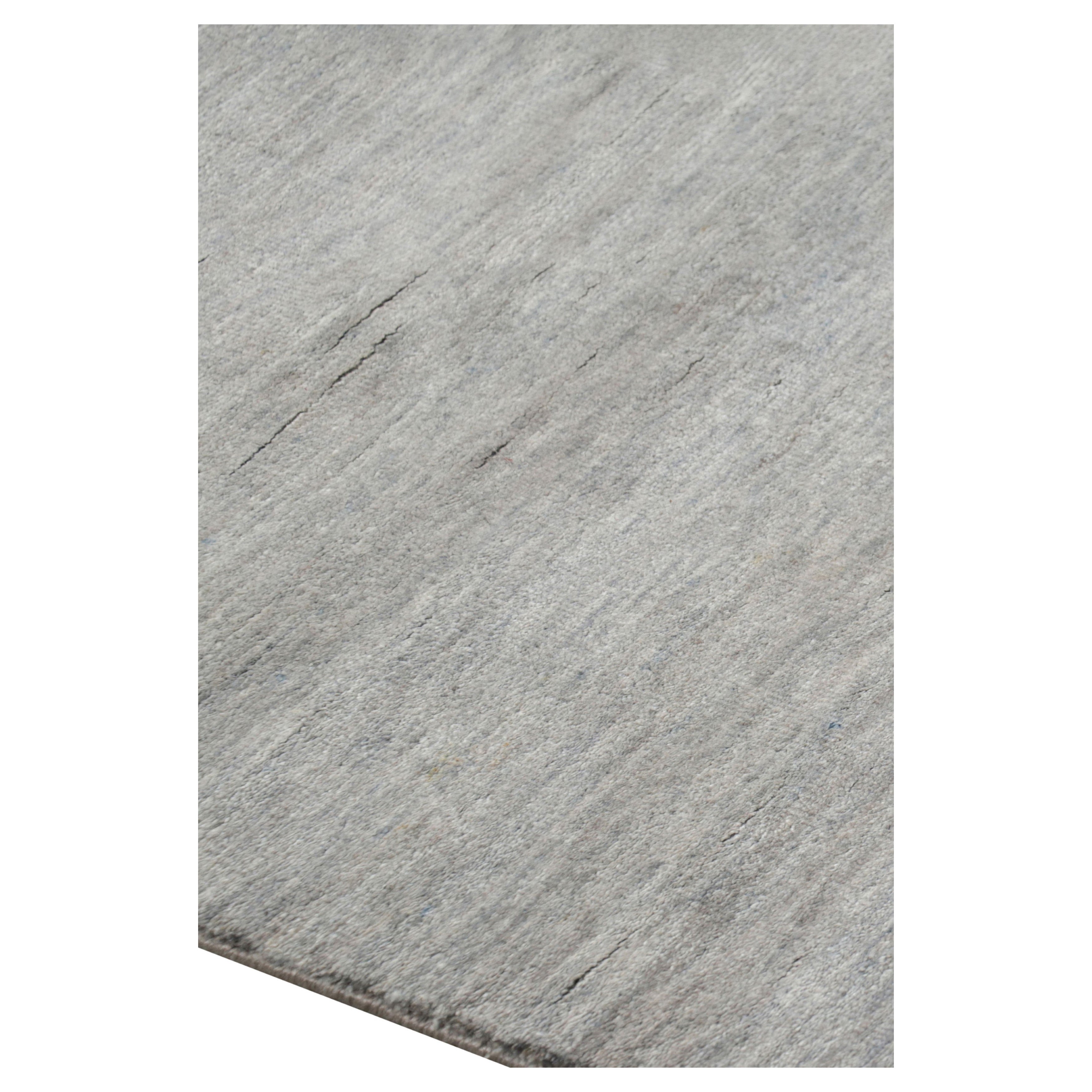 Noué à la main dans un luxueux mélange de laine et de soie, ce tapis 8x10 est un nouvel ajout à la collection de tapis Textural de Rug & Kilim - avec une gamme impressionnante de couleurs et une attention au mouvement dans son jeu unique de rayures,
