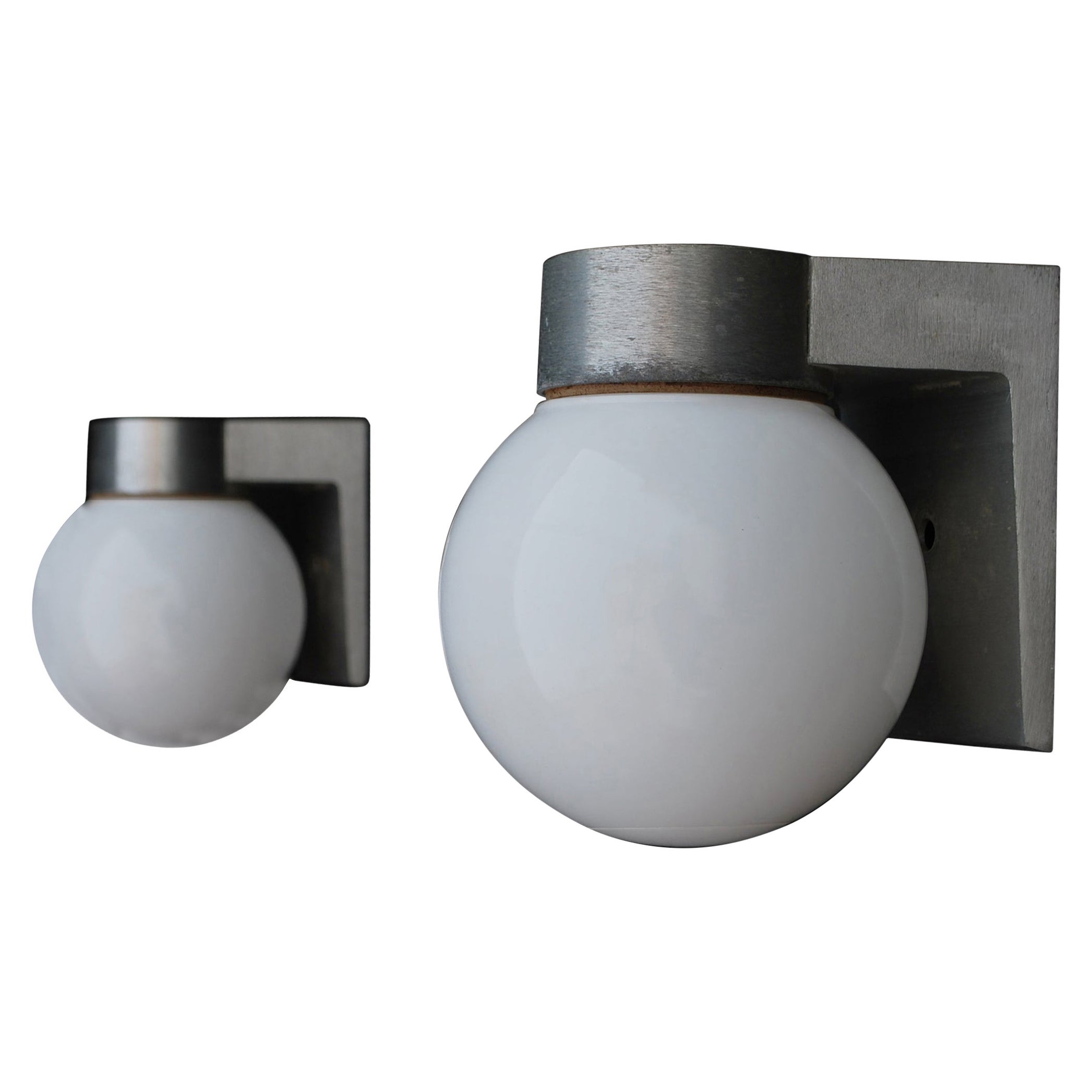 Sexy and rare pair of 1960's outdoor sconces