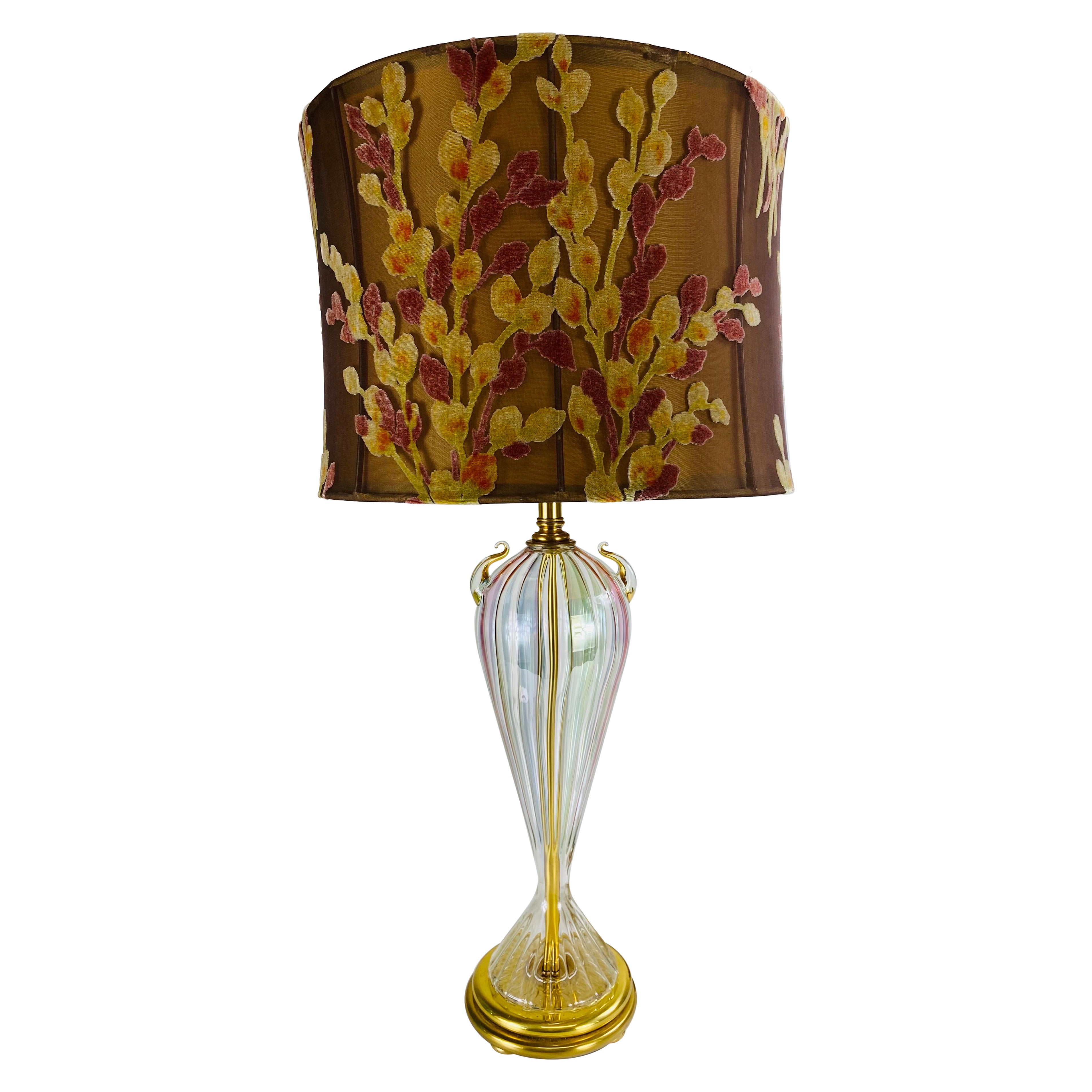 Elegant hand blown iridescent clear glass table lamp.