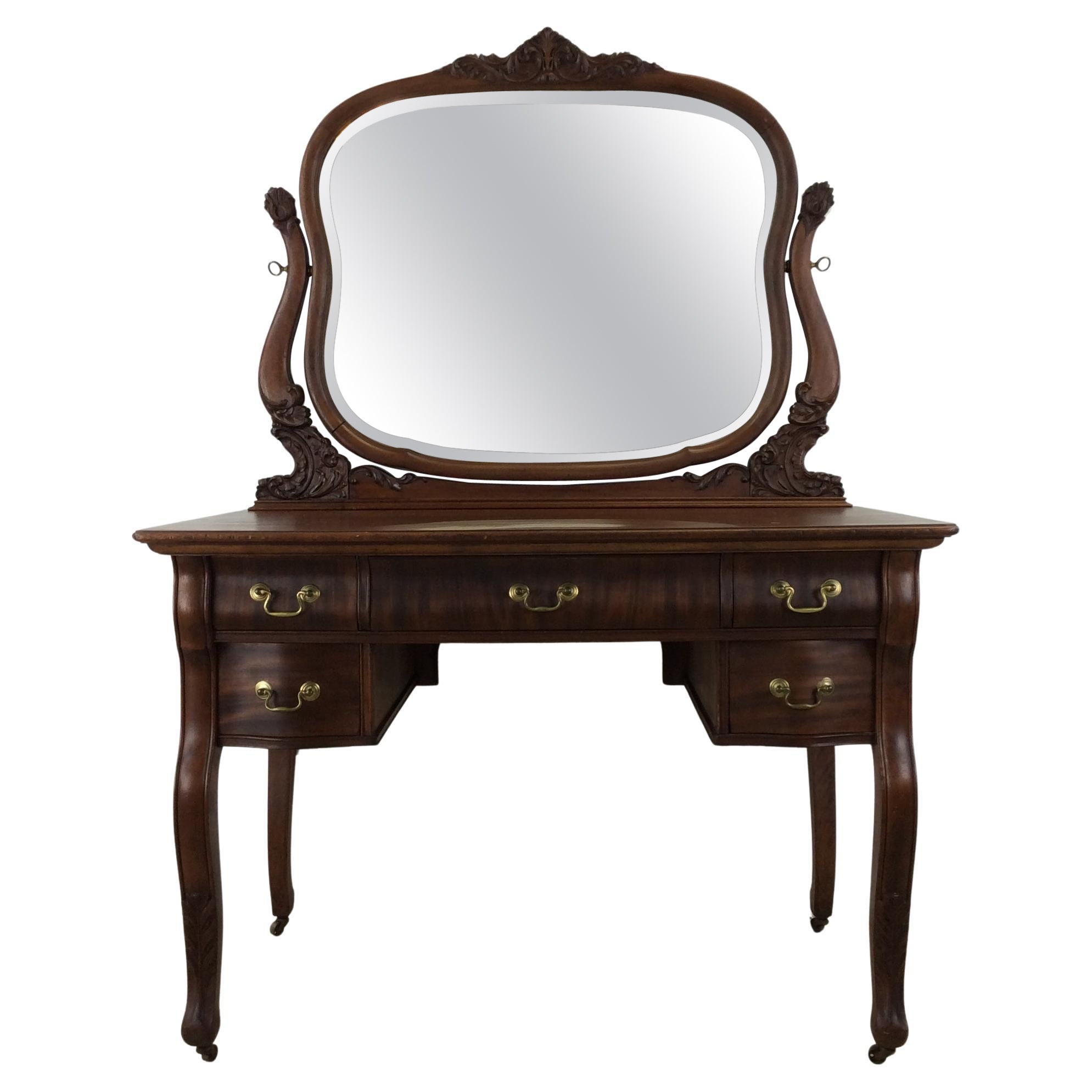 Antique mahogany mirrored vanity with brass hardware by widdicomb