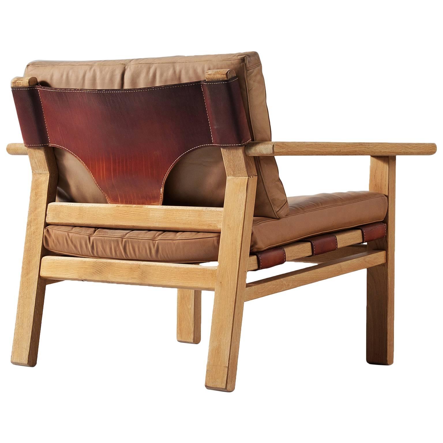 Kurt Ostervig Armchair in Oak and Leather for K.P. Møbler