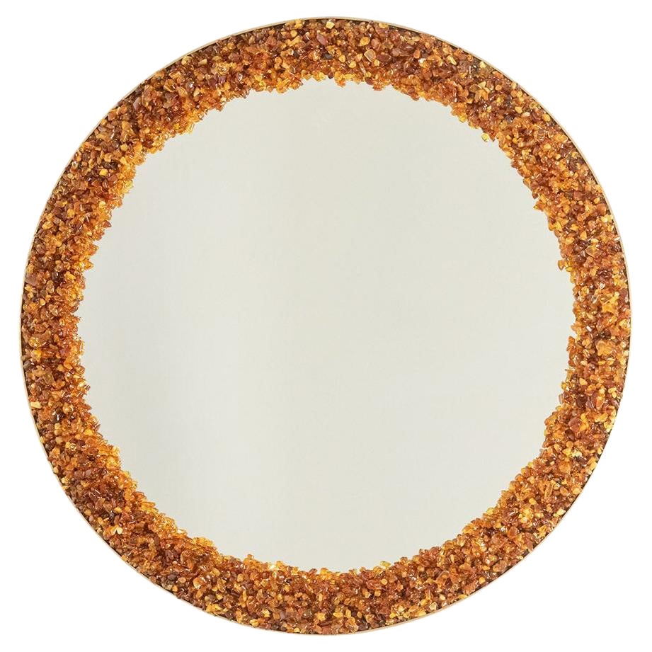 Circular, backlit mirror in amber. Contemporary artist work.