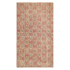 Alfombra vintage Zeki Müren roja con motivos geométrico-florales  Rug & Kilim