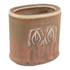 Gunnar Nylund for Rörstrand. Small ceramic vase with glaze in earthy tones.