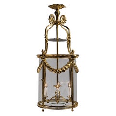 A Louis XVI Style Gilt-Bronze Cylindrical Four-Light Lantern