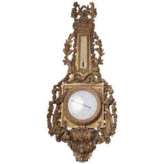 horloge et baromètre assortis en bois sculpté de style baroque français du 19ème siècle