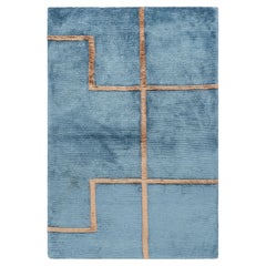 Muestra de alfombra moderna a medida de Rug & Kilim en azul y marrón con motivos geométricos