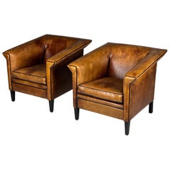 Pair of 2 Sheep’s leather Art Deco clubchairs