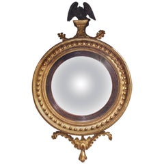English Gilt Convex Mirror with Ebonized Perched Eagle, Circa 1810