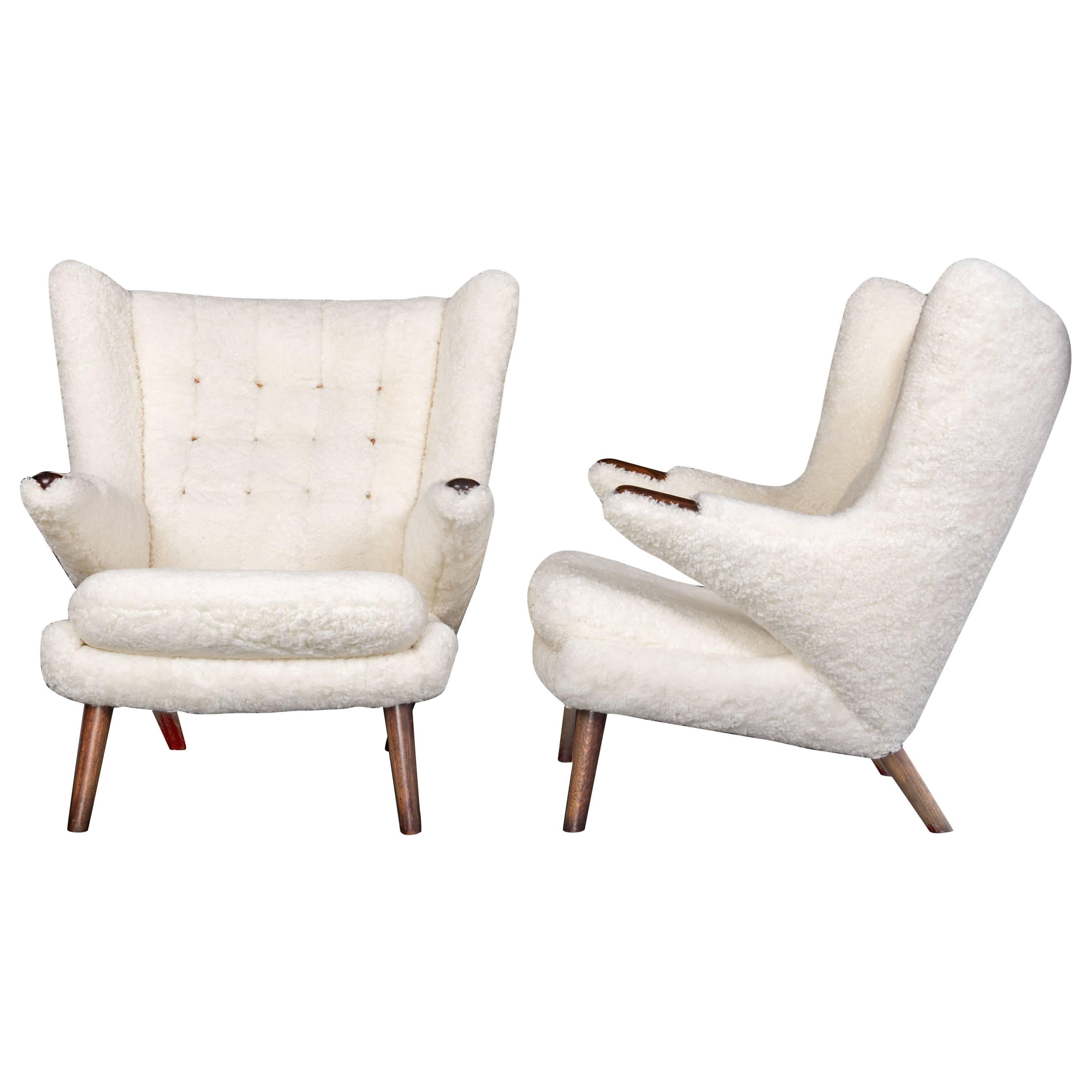 Hans J. Wegner Pair of Papa Bear + Stool. Sheepskin and Rosewood