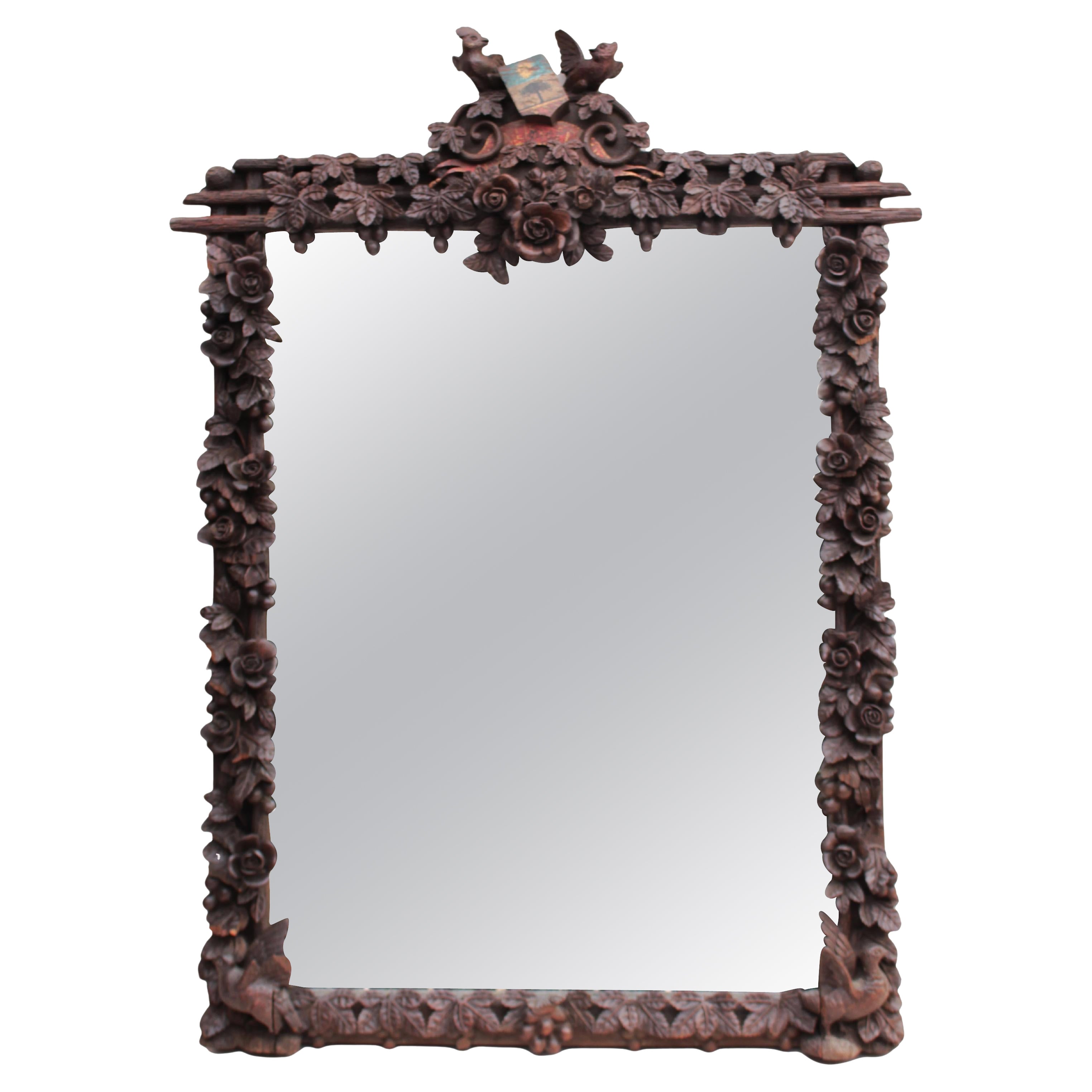 A Large 1880s Hand Carved Black Forest Mirror