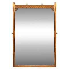 Charles Bevan style of. A Gothic Revival oak wall mirror