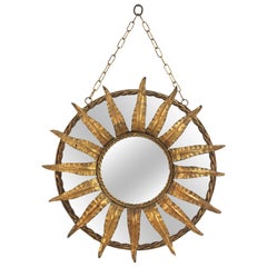 Wall Hanging Sunburst Mirror in Gilt Iron with Foliage Frame, France 1940s