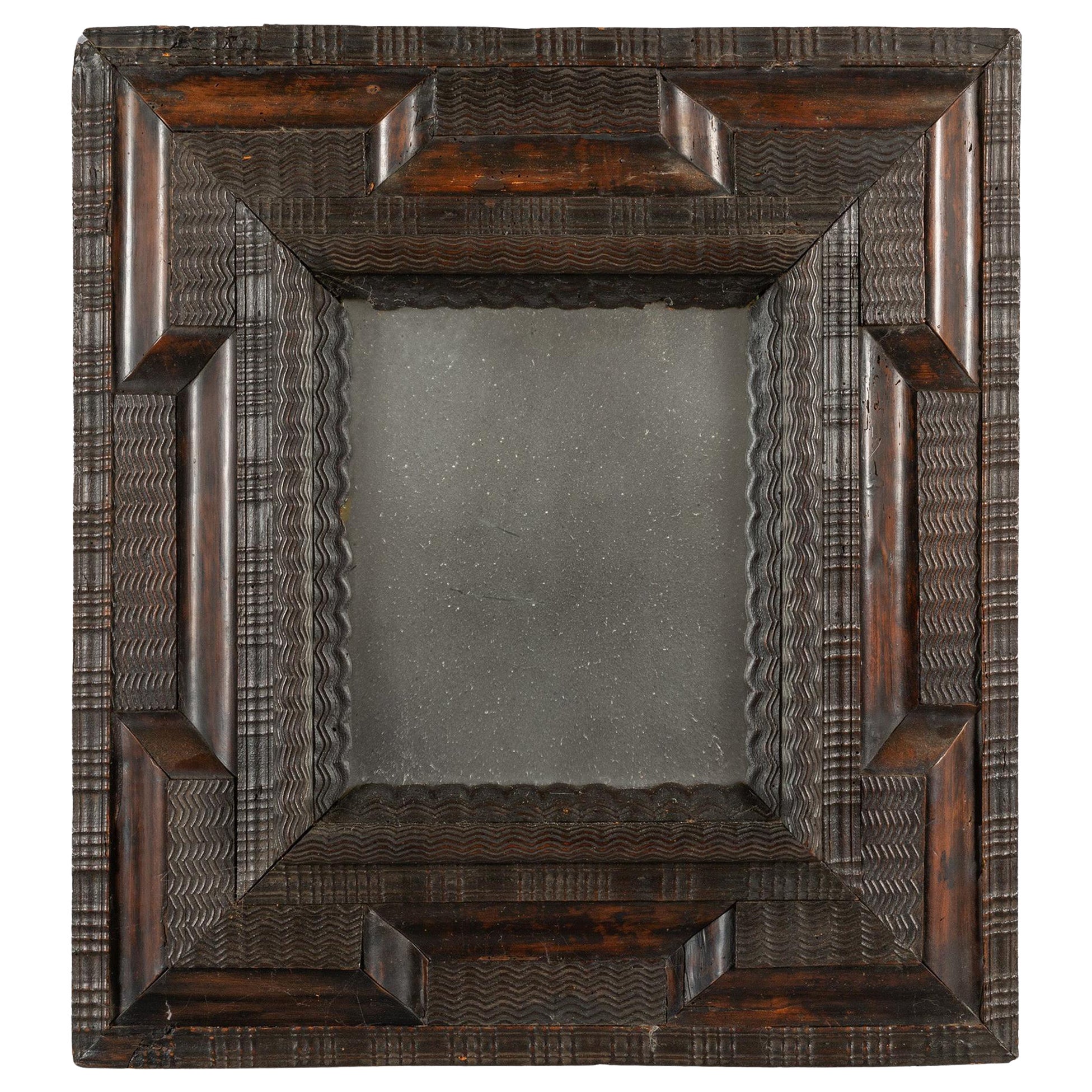 17th Century Italian Ebonised Ripple Framed Mirror
