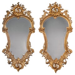 A Pair of Florentine Cartouche-Shaped Giltwood Wall Mirrors