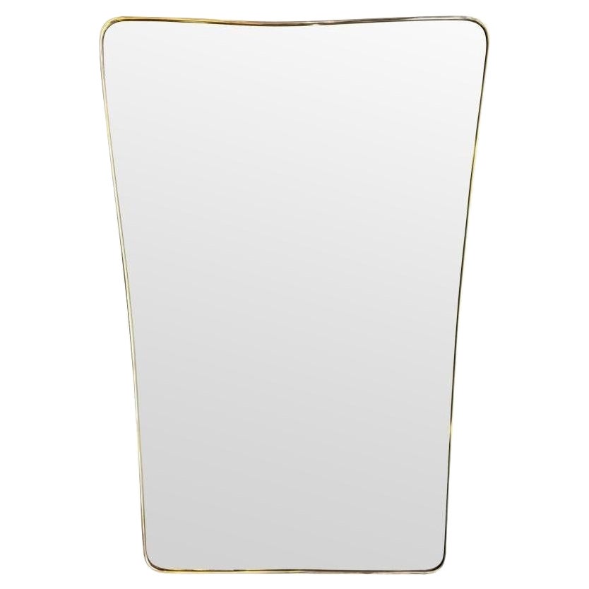 A large original Italian 1950s brass framed mirror with original bevelled plate