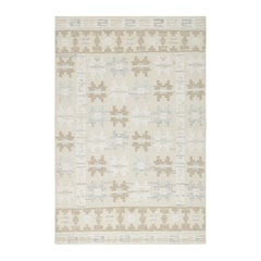 Alfombra de estilo escandinavo de Rug & Kilim en color topo y crema con motivos geométricos