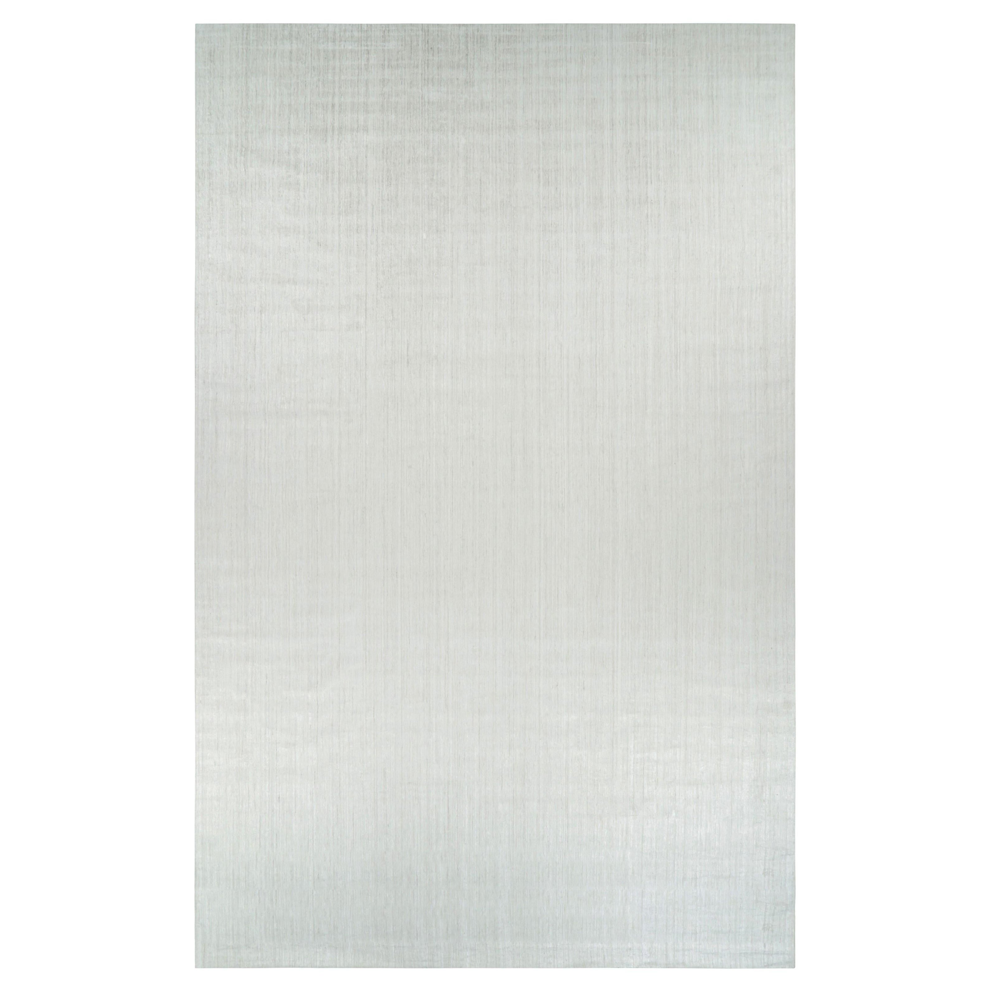 Tapis texturé surdimensionné de Rug & Kilim en blanc uni et rayures gris argenté